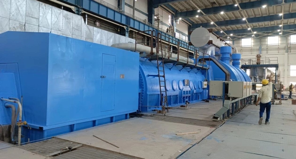 Industrial facility workers blue equipment